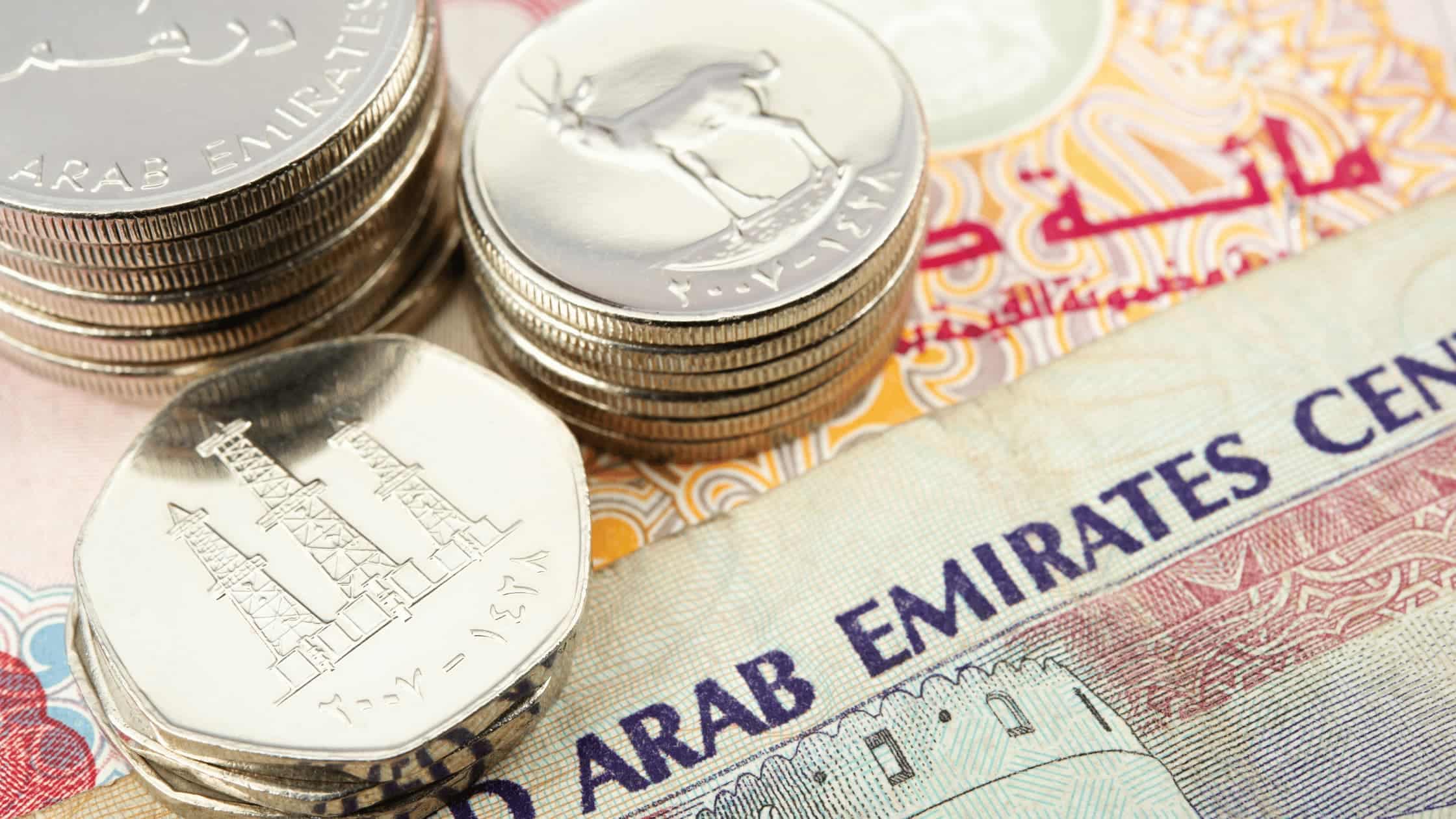 Close-up of a bank cheque being stamped with insufficient funds notice at a UAE bank counter