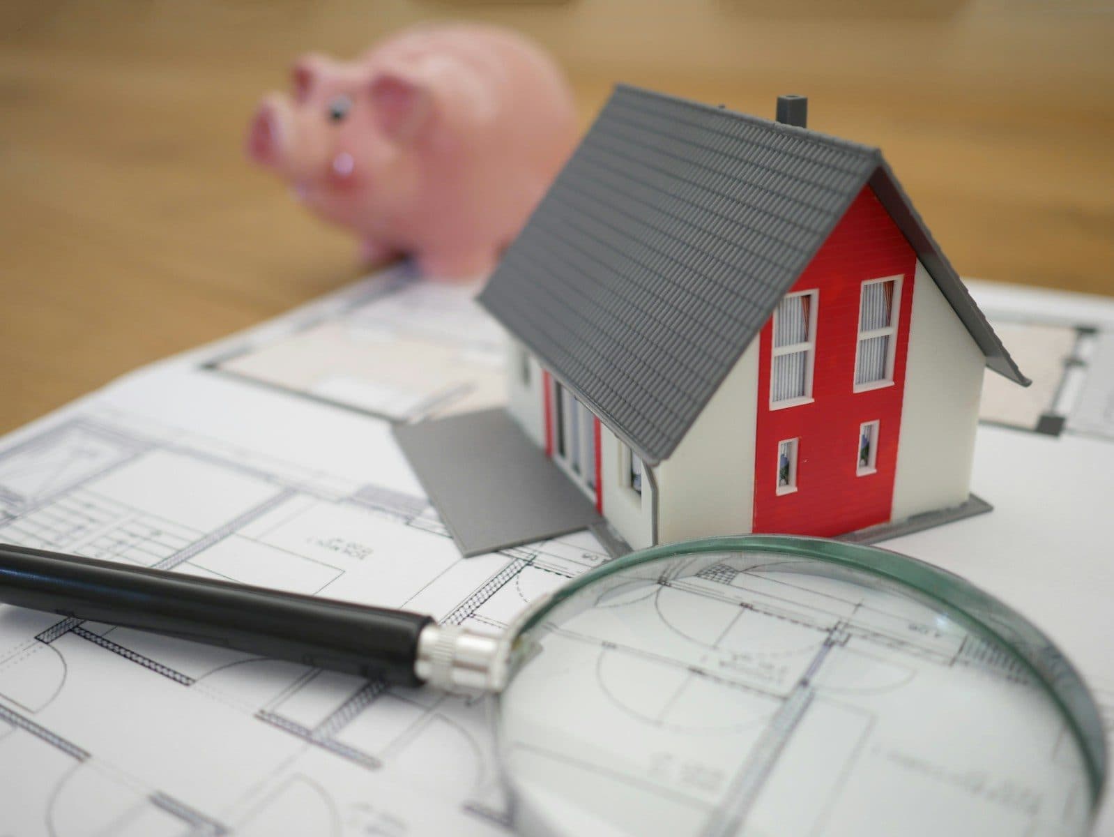 Manager's cheque and property deposit documentation on a desk with UAE banking forms and title deed paperwork
