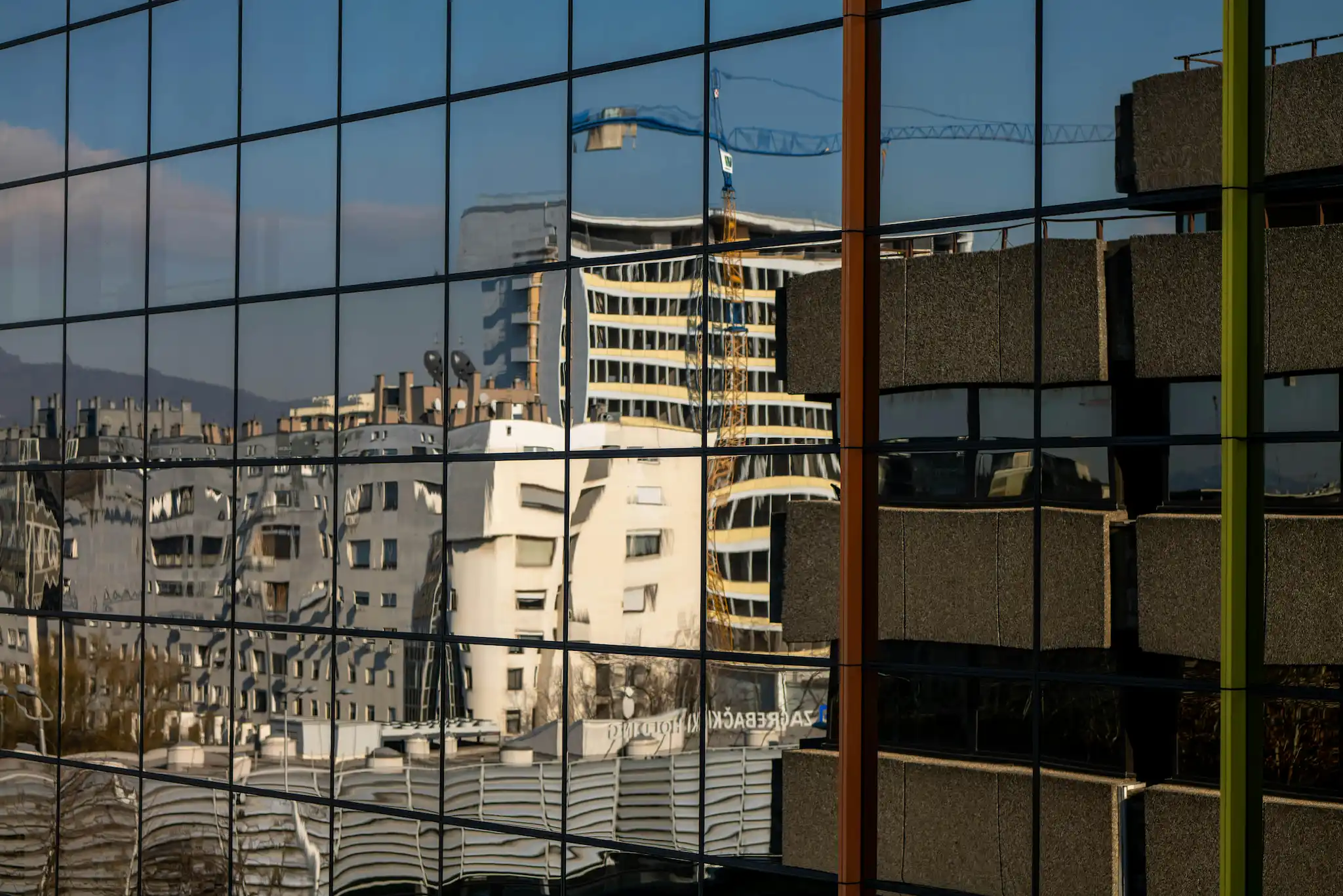 Modern office building entrance in Tallinn, Estonia with glass facade and corporate signage