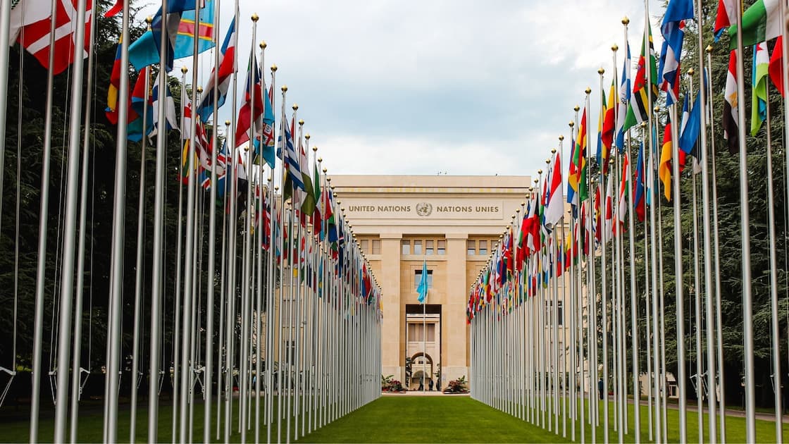 Modern embassy building exterior with national flags displayed at entrance in Riyadh, Saudi Arabia